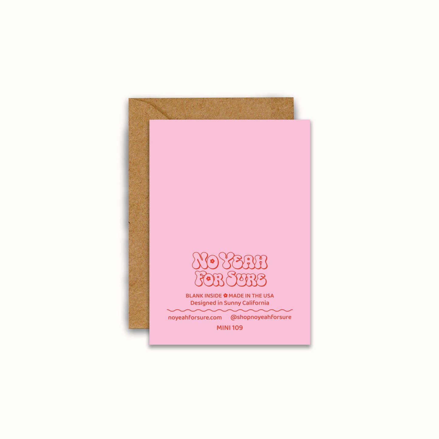 A pink greeting card with retro-style text reading 'No Yeah For Sure' and a brown kraft envelope behind it, shown on a light cream background.