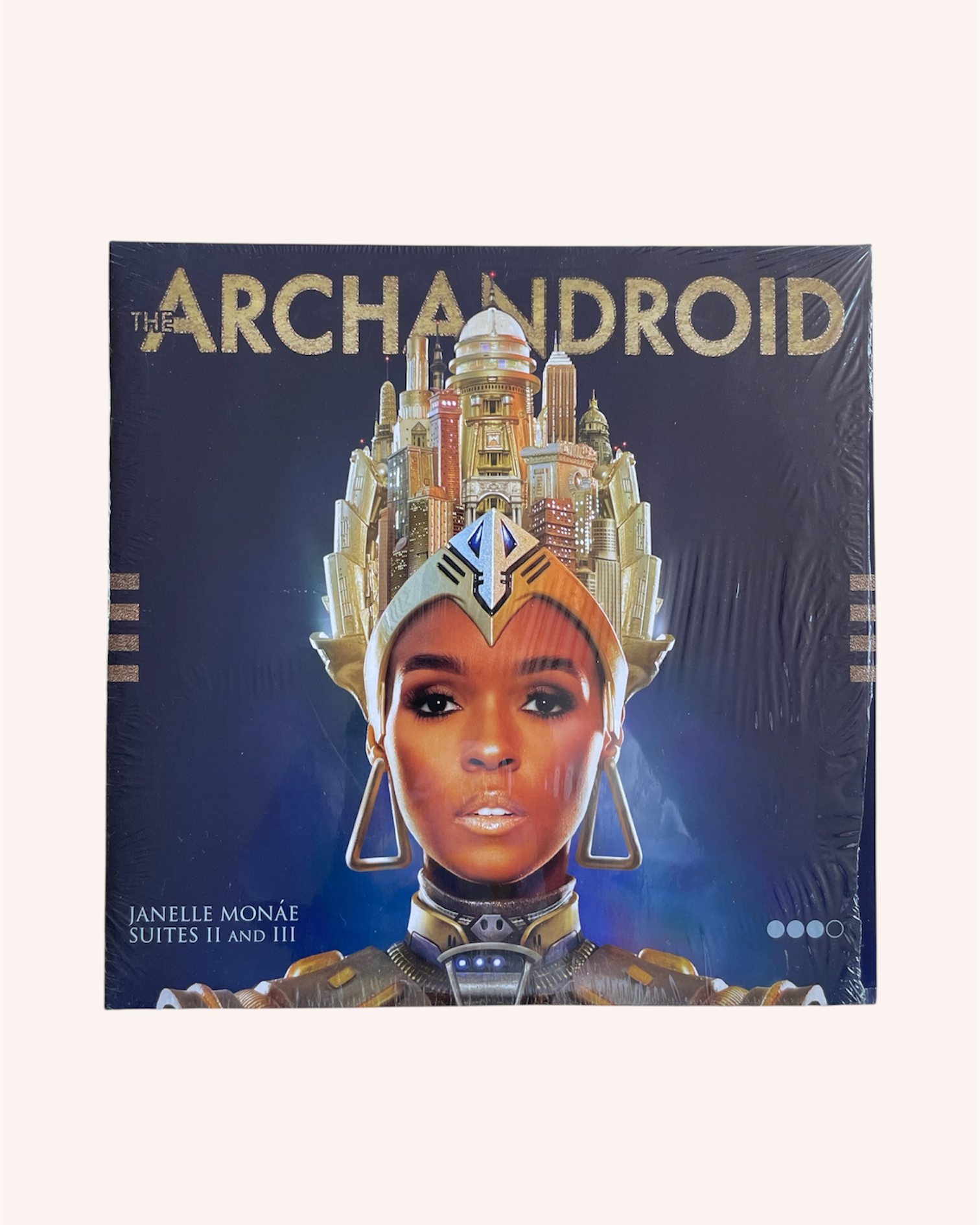Album cover for 'The Archandroid' featuring a person in futuristic attire with a cityscape background. The ArchAndroid - Janelle Monae