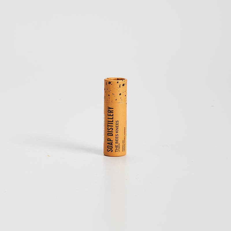 Cylindrical product with cork texture and branding on a white background