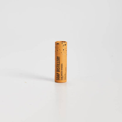 Cylindrical product with cork texture and branding on a white background