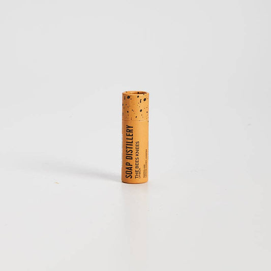 Cylindrical product with cork texture and branding on a white background