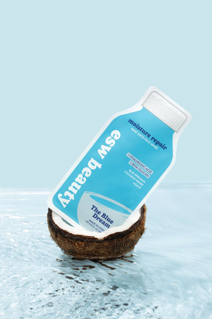 Coconut with a bottle labeled 'Eco Beauty' on a light blue background