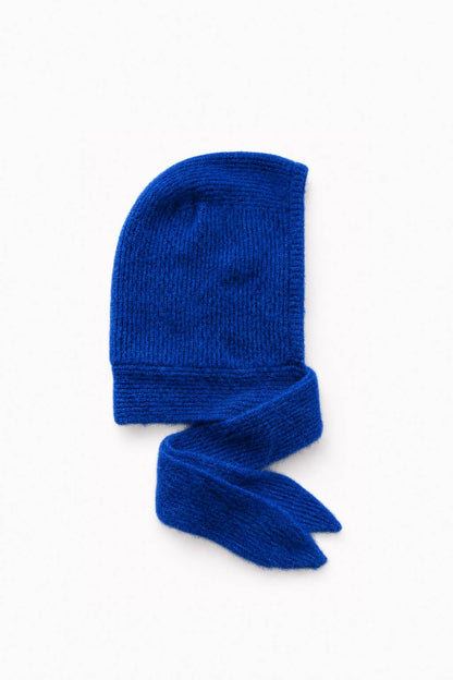 A vibrant royal blue knit bonnet with a matching knotted scarf, displayed on a clean white background.