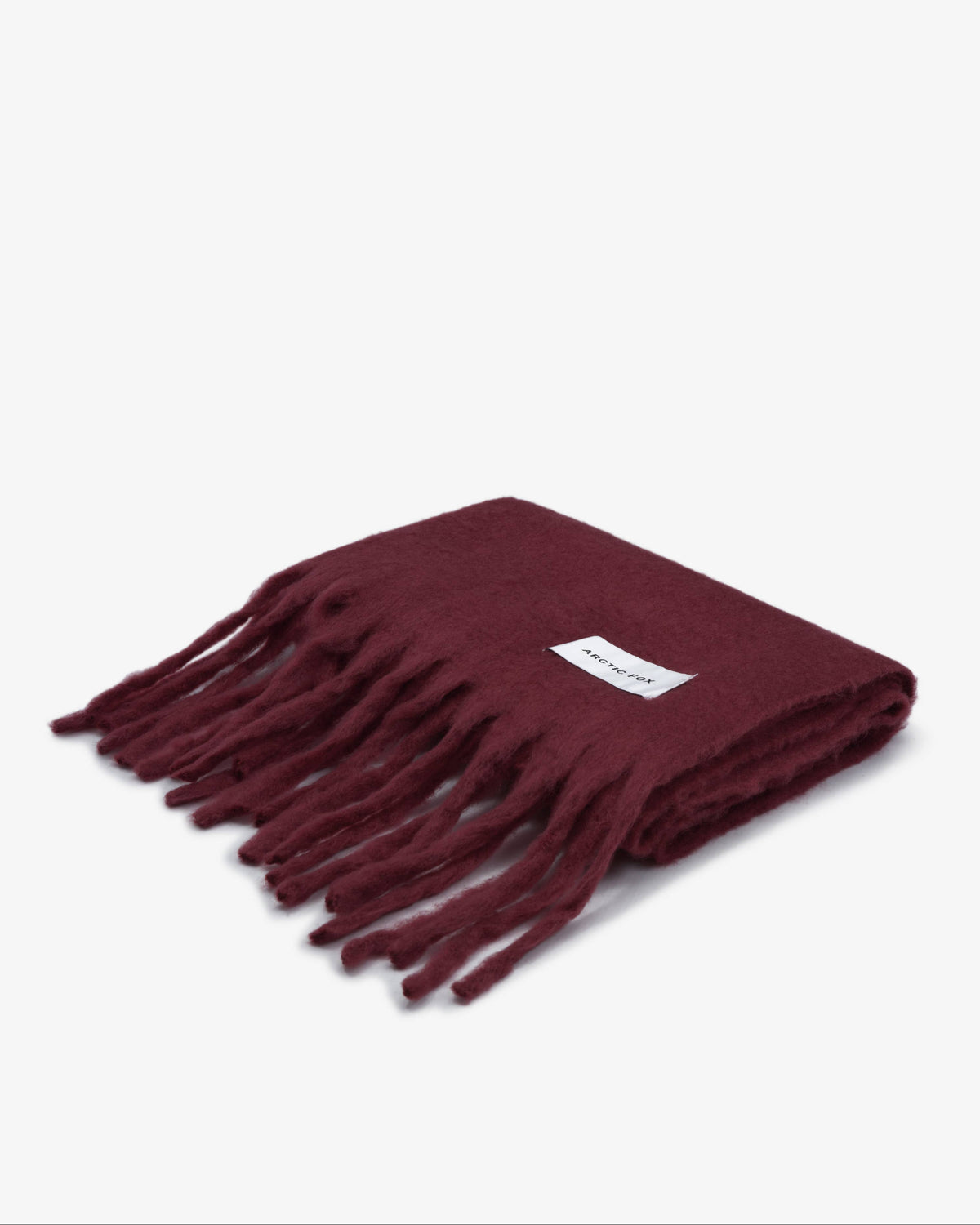 Maroon scarf with fringes on a white background
