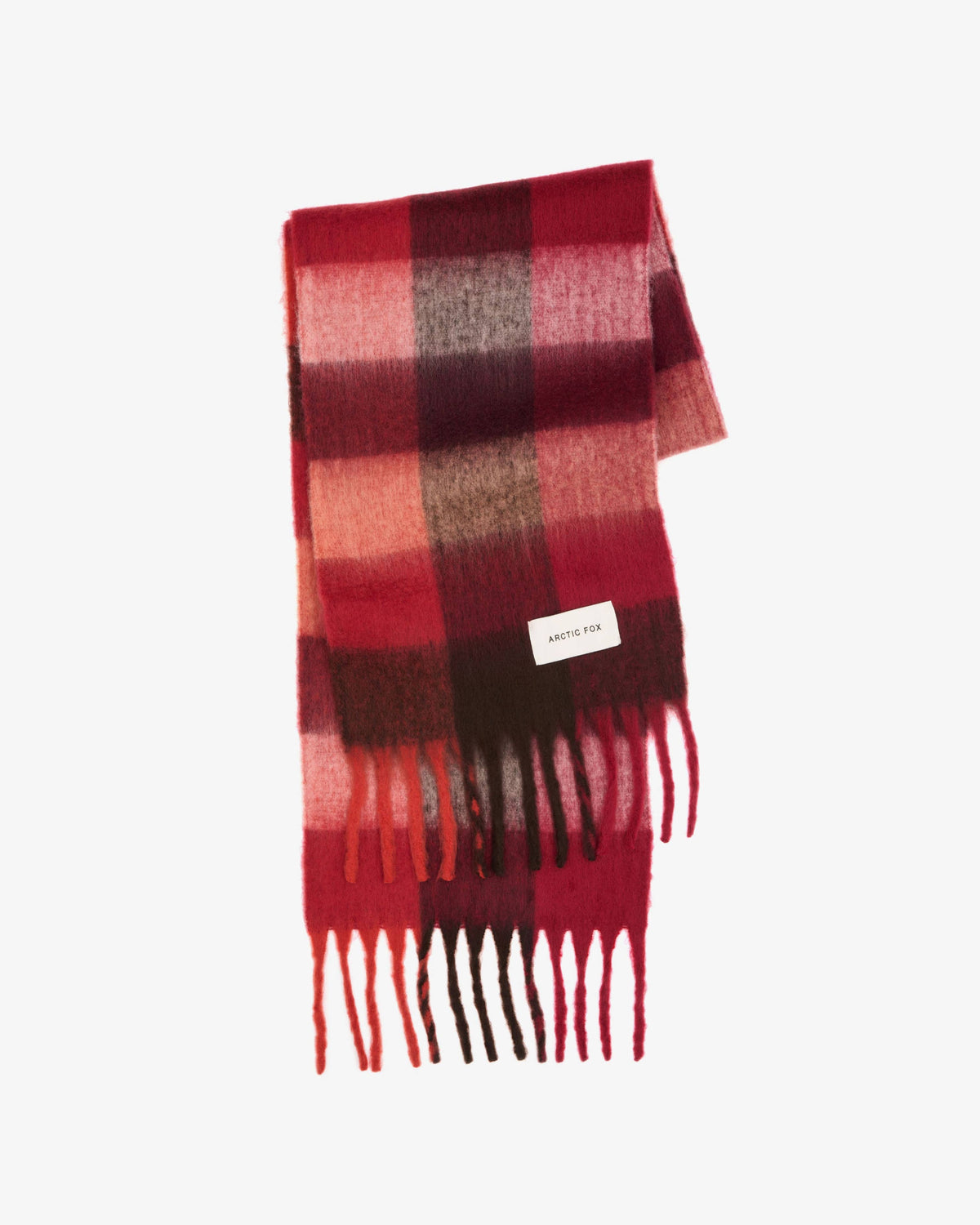 A folded plaid scarf in shades of red, pink, and dark brown, featuring a small white brand tag and fringed ends, set against a plain white background.