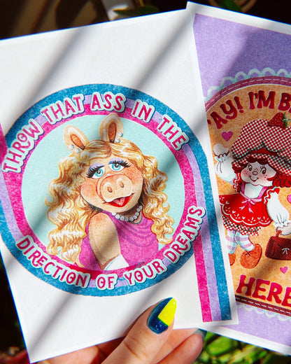 Two stickers featuring cartoon characters with text on a white background