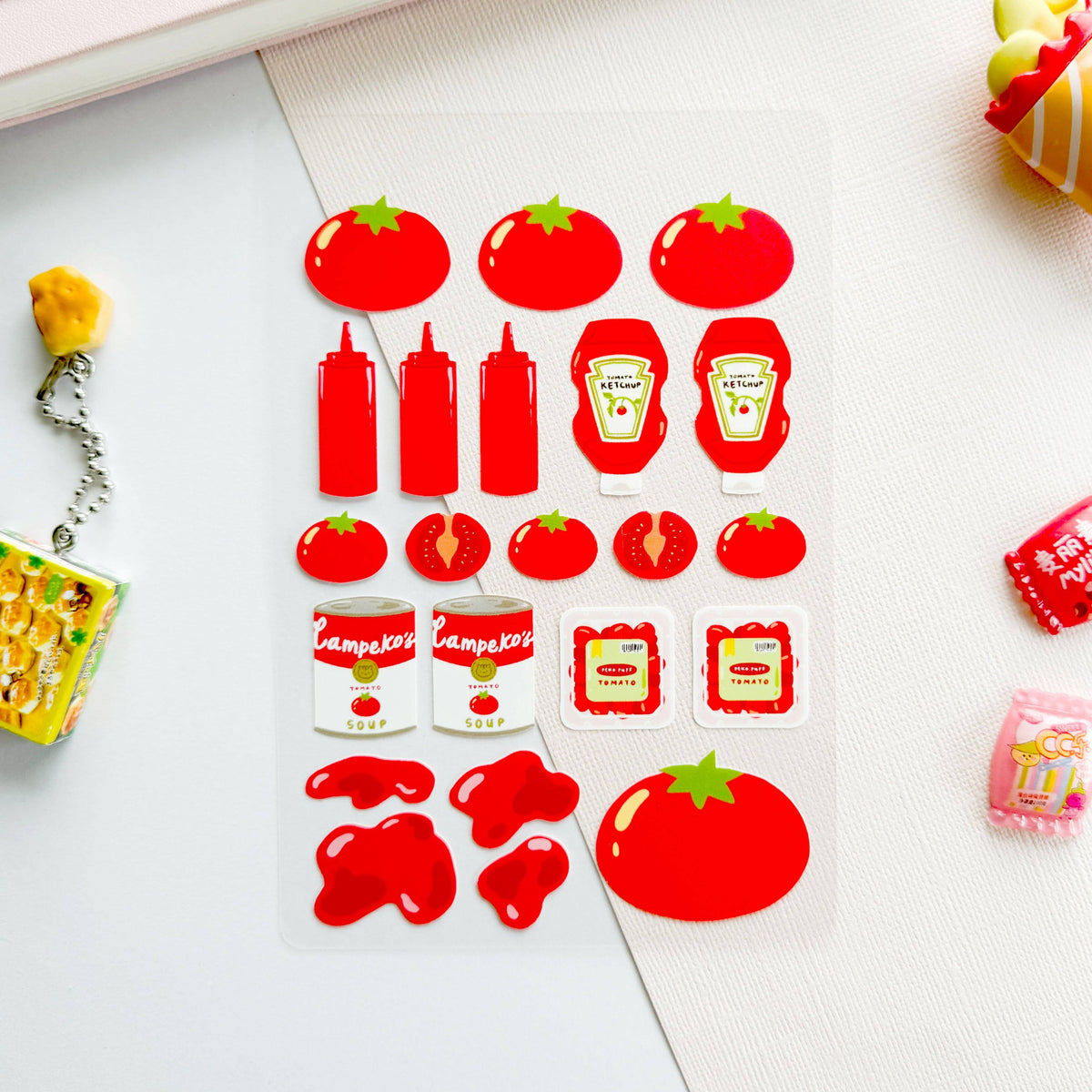 Sheet of red food-themed stickers including tomatoes, ketchup bottles, and cans on a white background.