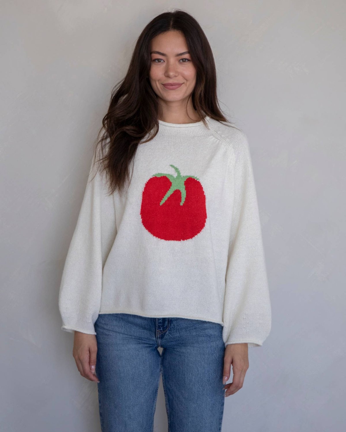 White sweater featuring bold red tomato, Playful tomato sweater, Cute tomato-themed sweater