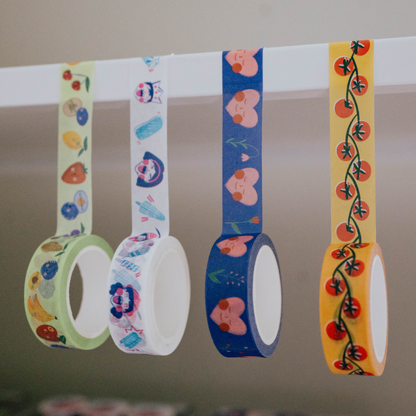 Set of colorful washi tape rolls with floral and abstract designs on a neutral background.