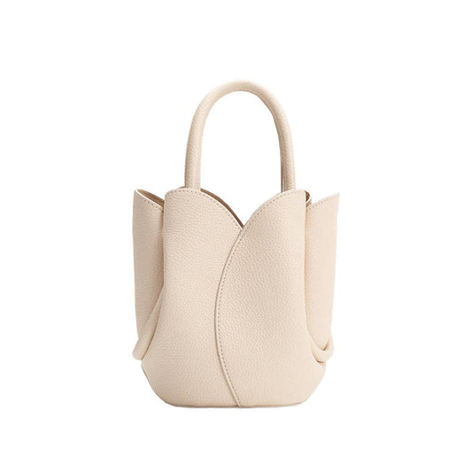 Beige handbag with a unique design on a white background, Tulip Mini Cream Top Handle Bag, Melie Bianco