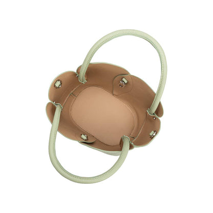 Tan handbag with white handles on a white background