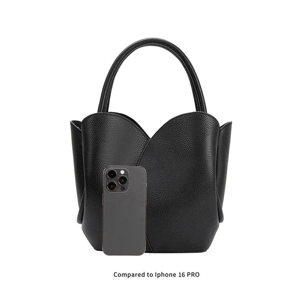 Black handbag with a smartphone inside, compared to an iPhone 16 Pro on a white background