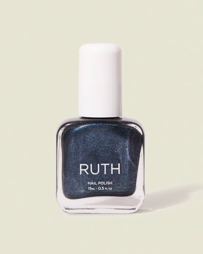 Nail polish bottle labeled 'RUTH' on a light green background, Twilight Metallic Grey Nail Polish Ruth Polish 
