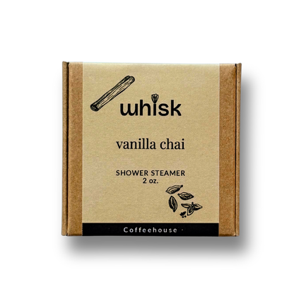 A square kraft paper box of Coffeehouse Whisk Vanilla Chai shower steamer, 2 oz, shown on a white background with a soft drop shadow.