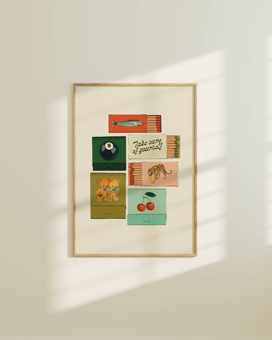 Framed artwork with colorful matchbox designs on a white wall