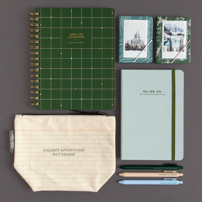 Collection of stationery items including notebooks, a pouch, and pens on a gray background