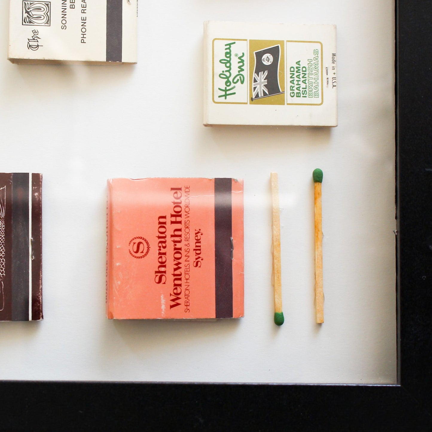 Matchbooks and matches on a white surface