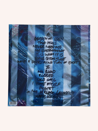 Vinyl record with text on a blue and white striped background, What a Devastating Turn of Events - Rachel Chinouriri