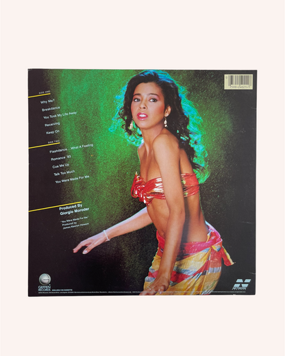 Vinyl record cover with a person in colorful attire on a green background, What a Feelin' Vinyl Record - Irene Cara