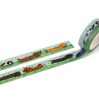 Roll of decorative tape with dog illustrations on a white background