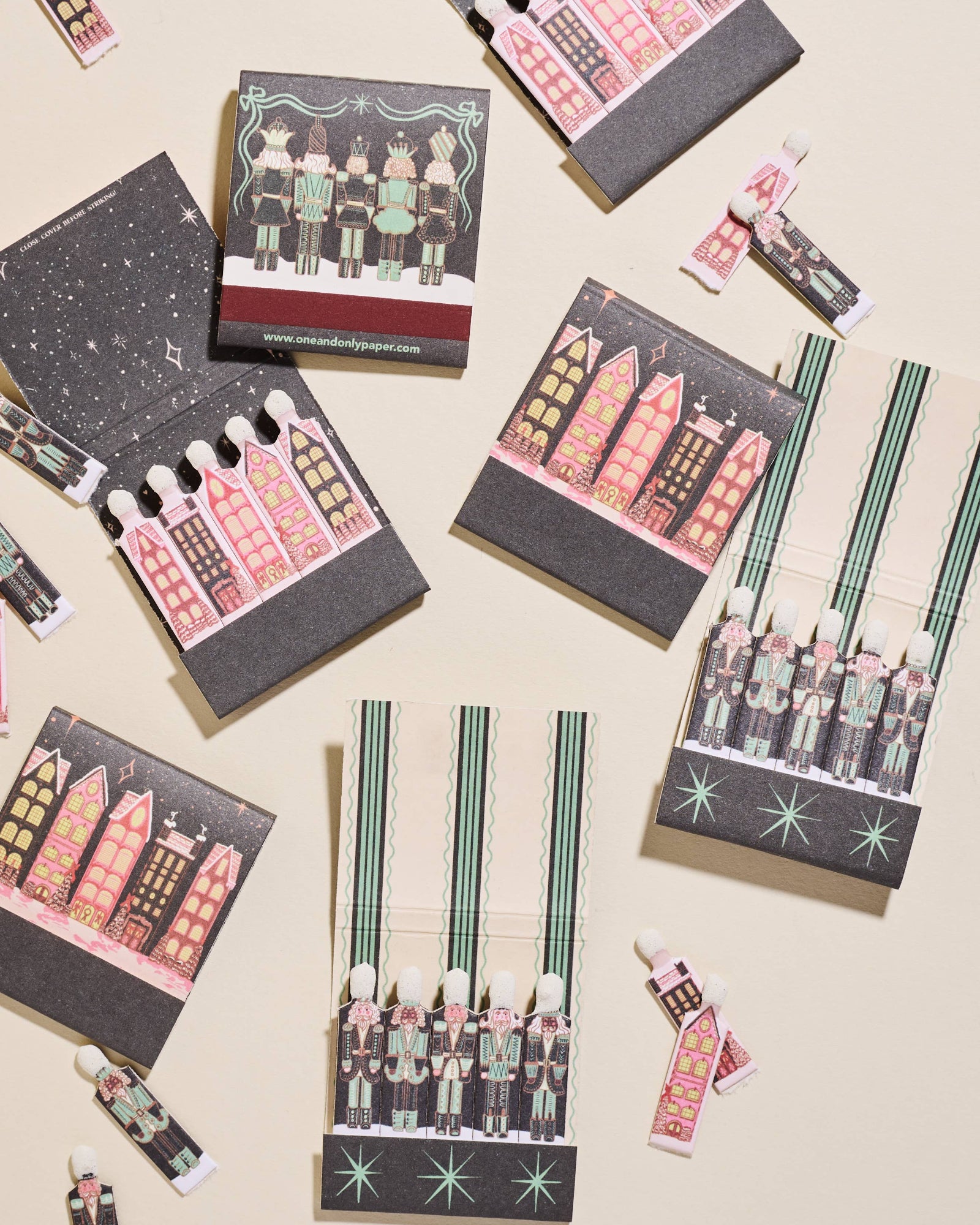 Set of small matchbooks  with house and nutcracker illustrations. Wintry Village Printed Matchbook