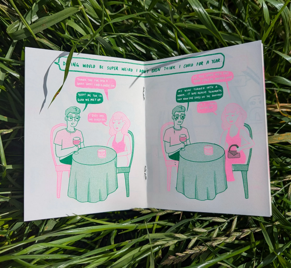 Comic book open on grass with two people at a table. Would You Still Love me if I was A Worm? Risograph Zine