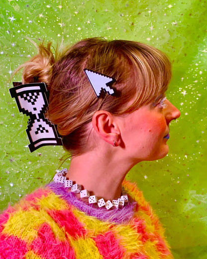 Person with pixelated hair clips on a green background