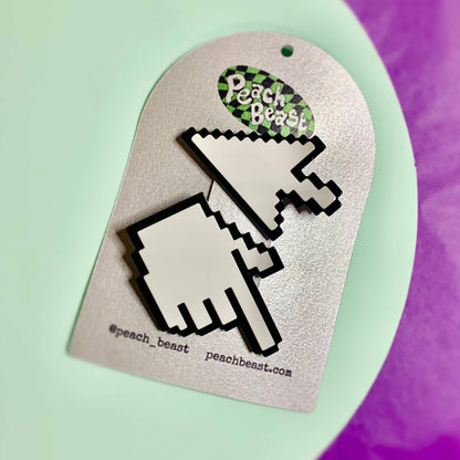 Pixelated hand cursor design on a branded card with 'Peach Beast' branding.