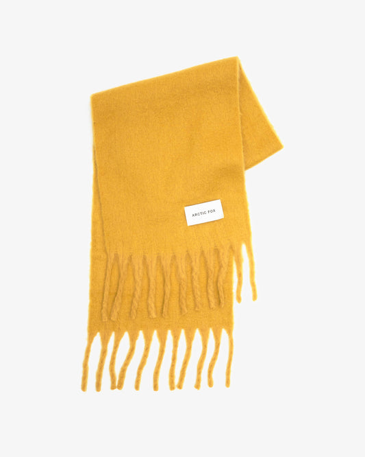 Yellow scarf with fringes on a white background